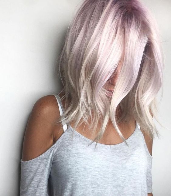 woman showing her light pink and white ombre hair