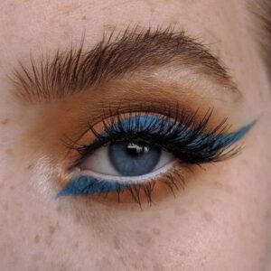 A lady Wearing Blue Eye Shadow