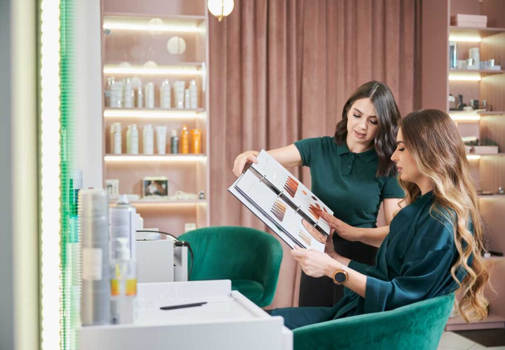 woman choosing hair color in salon