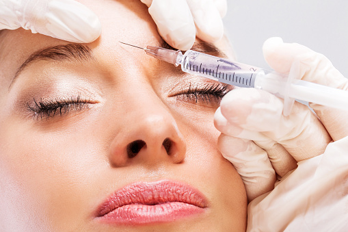 Close up of woman receiving beauty treatment with Botox.