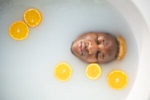 a man grooming ritual with lemon in a relaxing tub
