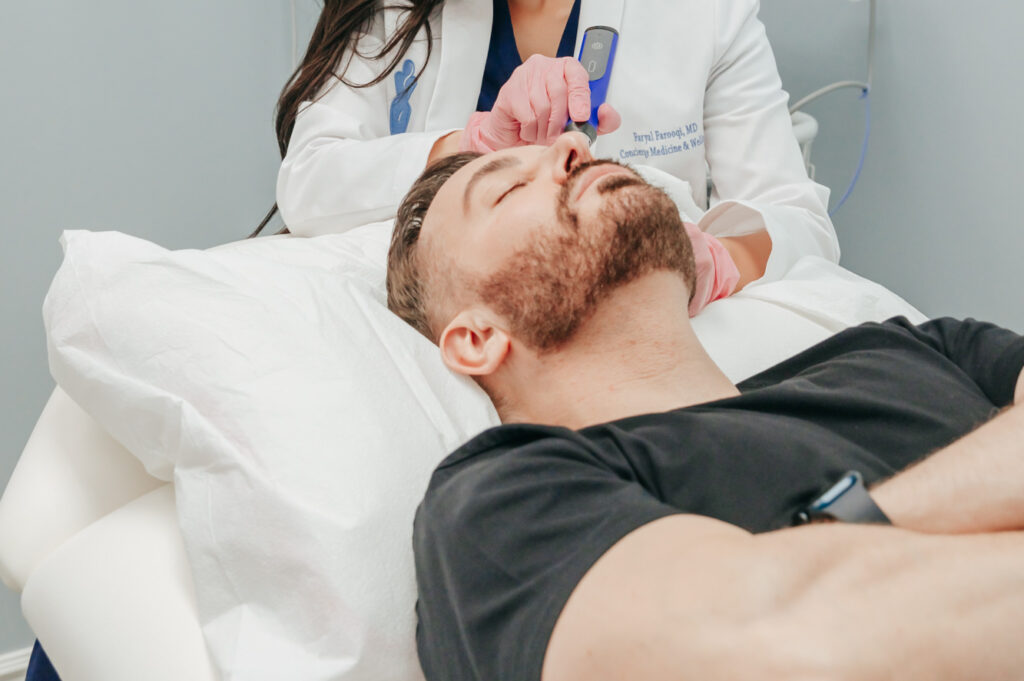Close up of man getting hair restoration service